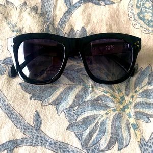 Black and gold Frye sunglasses